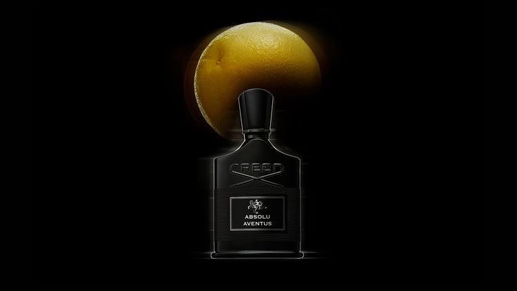 Absolu Aventus with Grapefruit in the background 